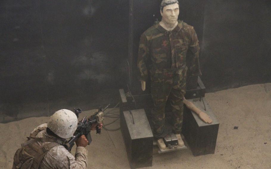 A Marines closes on his target at the Rodriguez Live Fire Complex's live-fire shoot house in June 2015 in South Korea.
