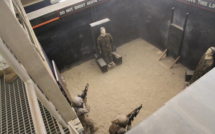 Marines clear a room at the Rodriguez Live Fire Complex's live-fire shoot-house in June. The 3rd Battalion, 2nd Marine Regiment troops were on the final phase of their Unit Deployment Program.