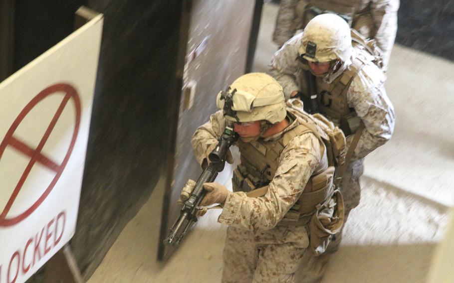 Marines storm the Rodriguez Live Fire Complex's live-fire shoot-house in June. The Camp Lejeune-based unit grunts were in the final phase of the Unit Deployment Program.
