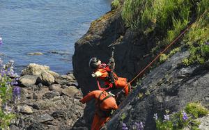 AST2 Jonathan Kreske conducts cliff ops training on Kodiak Island, Alaska. Air Station Kodiak aircrews often train for these rescues to stay proficient in the event they are needed to rescue someone from a cliff side.