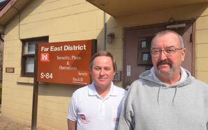 Robert Lamoureux, left, stands with colleague Jerry Giefer outside offices at the Army Corps of Engineers Far East District compound in Seoul. Lamoureux was honored in March by Seoul fire officials for helping save Giefer's life after a heart attack.