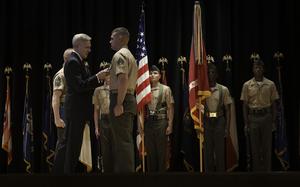 131101-N-PM781-001CAMP LEGEUNE, N.C. (Nov. 1, 2013) Secretary of the Navy (SECNAV) Ray Mabus presents Sgt. Joshua Moore, assigned to 2nd Battalion, 8th Marines, with a Navy Cross medal. Moore earned the award for his heroism during combat operations in 2011 while deployed to Northern Marjah, Helmand Province, Afghanistan.