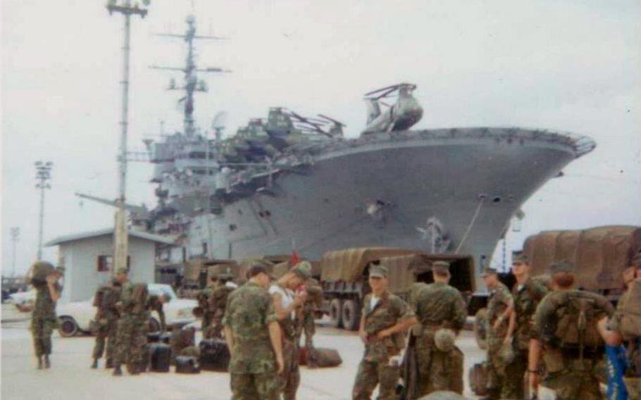 As described by Murrie Hubbard: "Pic I took at the White Beach docks in Okinawa, Japan, on or about June 16, 1972, as our Marine battalion was preparing to embark onboard 4 U.S. Navy ships; the USS Tripoli is one of those 4 ships in the background. We were headed for landing operations in the Philippines followed by Yankee Station in the Gulf of Tonkin, Vietnam, in support of combat operations during the Easter Offensive."