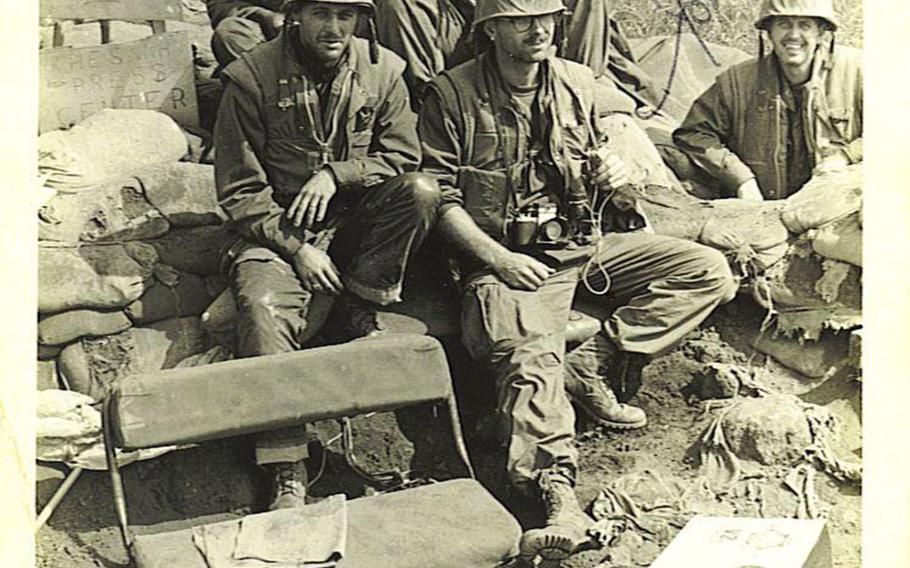 As described by Edward M. Evans: "A photo of the crew of Marine photojournalists and combat correspondents at our bunker alongside the runway at Khe Sanh Combat Base. Left to right, back row, are Jim Brown and Chuck McCormick; left to right, front row, are Phil Hartranft, Ed Evans, and John Wachter."