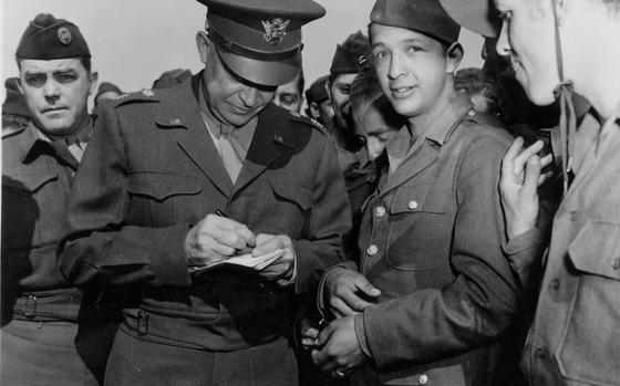 Staff Sgt. Charles Kiley, left, was assigned by his Stars and Stripes editors to cover General Dwight d. Eisenhower near the end of World War II. In this April 1945 photo, Eisenhower meets repatriated Allied prisoners of war in France.

Courtesy of U.S. Army
