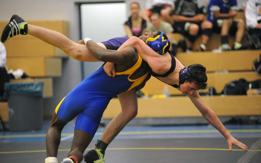 Bamberg's  Zarquel Webb lifts Sam Nevinger of Mannheim in their 145-pound match won by Webb during a four-team competition in Heidelberg on Saturday.