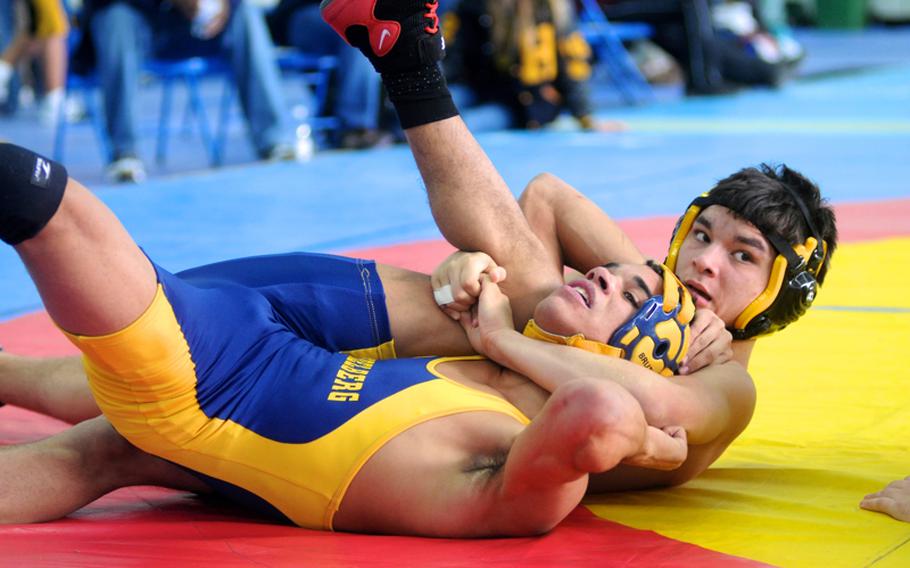 Patch wrestler Chris Carlisle wrestles Heidelberg's Marquez Ensey during a 126-pound weight class round robin match at the Eastern Sectionals hosted by Patch. Carlisle won the match and took second place in his weight class.