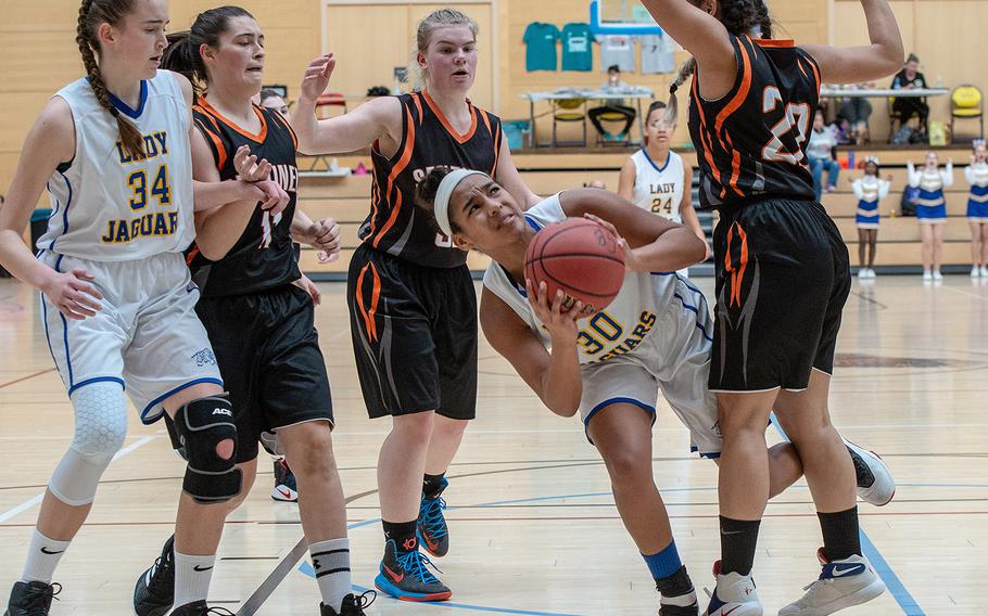 Sigonella's D'Anna Holland drives to the basket during the Division III  basketball championship game between Sigonella and Spangdahlem at Clay Kaserne Fitness Center, Germany, Saturday, Feb. 23, 2019. Sigonella won the game 37-35. 