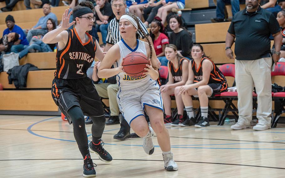 Sigonella's Jessica Jacobs drives to the basket during the Division III basketball championship game between Sigonella and Spangdahlem at Clay Kaserne Fitness Center, Germany, Saturday, Feb. 23, 2019. Sigonella won the game 37-35. 