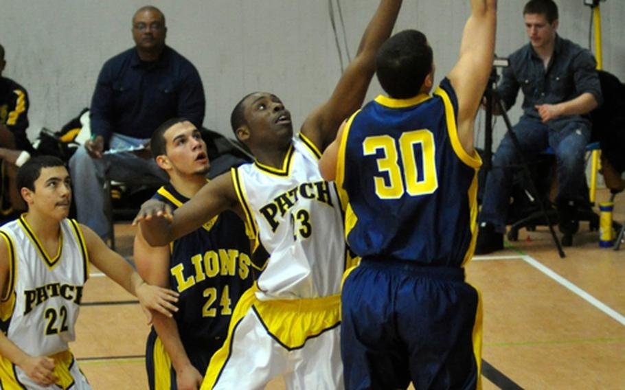 Heidelberg's Marcel Simon scores two points during Tuesday night's game between the Lions and Patch. Heidelberg won the game, 52-37, staying unbeaten and clinching the Region III title. 