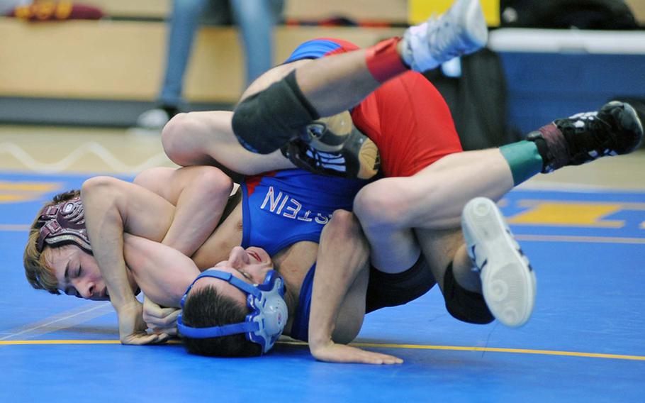 In an exciting 106-pound semifinal, Baumholder's Blake Brittain, left, beat Ramstein's Steve Cavanaugh in a 6-5 decision and is to face Kaiserslautern's Matt Fischer in Saturday afternoon's final at the DODDS-Europe wrestling championships in Wiesbaden. 