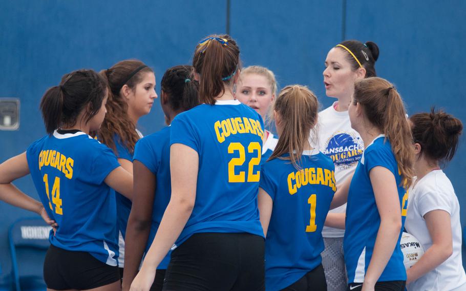 Coach Desma Colburn rallies herAnsbach Cougars during an early match against Vilseck on Saturday, Sept. 20, 2014. 
