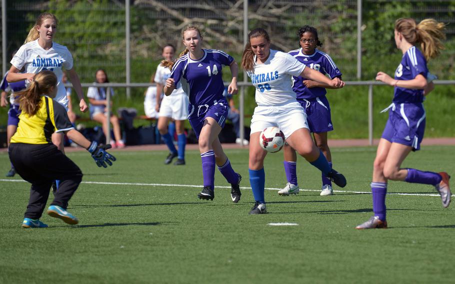 Rota's Tayla Irby tries to get a shot off against the Bahrain defense in opening-day Division II action at the DODDS-Europe soccer finals in Landstuhl, Germany. The Admirals beat Bahrain 2-1.