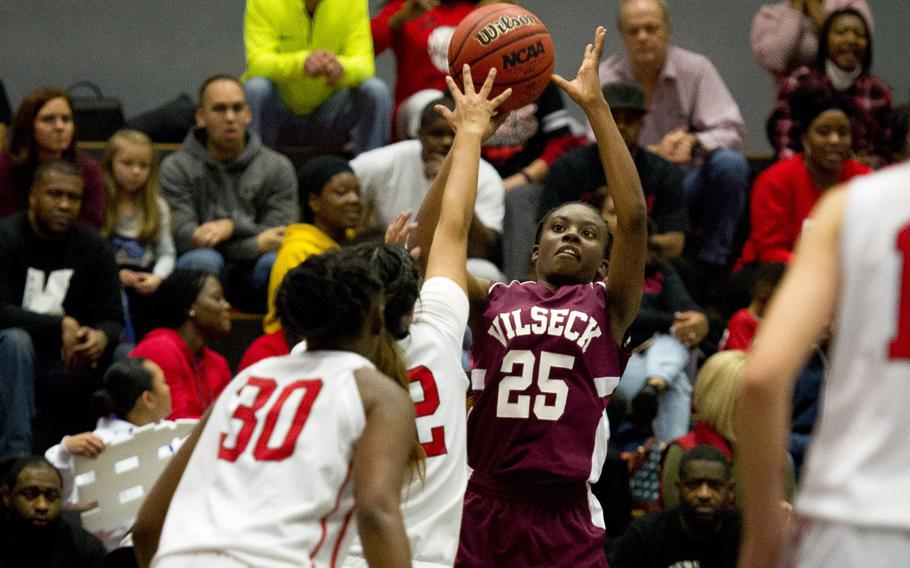 Vilseck's Tynniesia Wilson shoots over Kaiserslautern's Alicia Alamos at Vogelweh, Germany, on Friday, Dec. 1, 2017. Vilseck won the game 30-24.