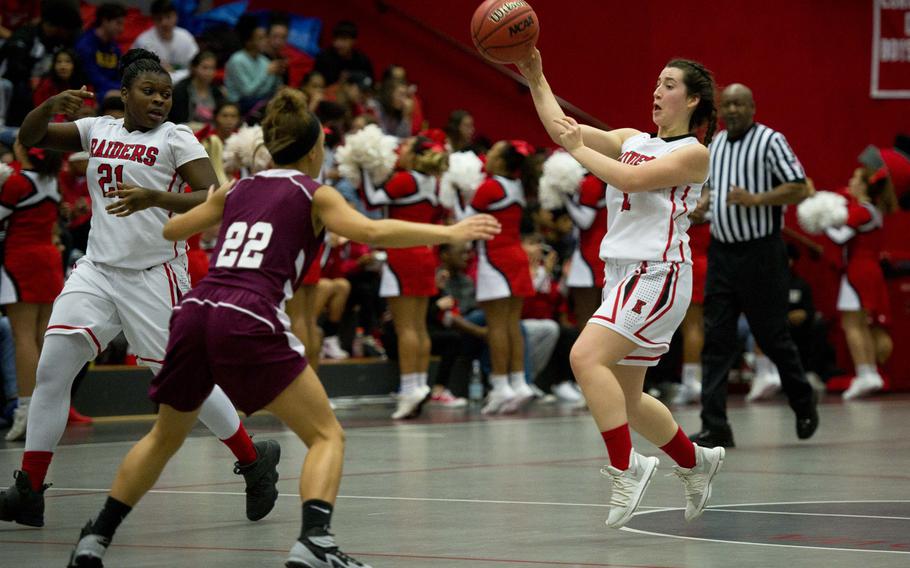 Kaiserslautern's Brooke Fitzpatrick, right, passes the ball over Vilseck's Kayla Silva as LeJhanique Brown looks back at Vogelweh, Germany, on Friday, Dec. 1, 2017.