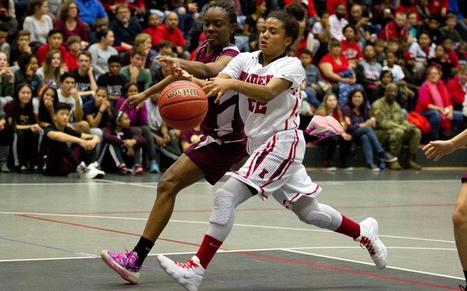 Kaiserslautern's Jaelyn Salton, right, tries to dribble past Vilseck's Tynniesia Wilson at Vogelweh, Germany, on Friday, Dec. 1, 2017. Kaiserslautern lost 30-24.