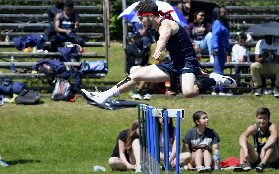 Lakenheath's Chris Hayden defies gravity in the 300-meter intermediate hurdles during a high school track meet at RAF Lakenheath, England, Saturday, May 19, 2018. Hayden took first with a time of 41.95 seconds.
