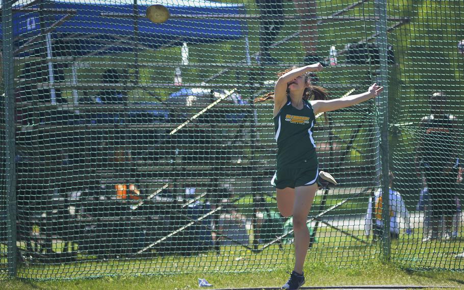 Alconbury's Anna Downing throws a discus during a high school track meet at RAF Lakenheath, England, Saturday, May 19, 2018. Downing finished third after throwing 82 feet, 2.5 inches.