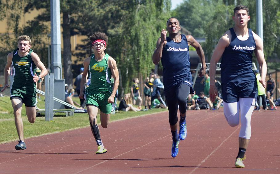 Lakenheath's Kobe Cox breaks away from teammate Deshawn Wilkerson in the 100-meter dash during a high school track meet at RAF Lakenheath, England, Saturday, May 19, 2018. Cox clocked in at 11.18 seconds for first place.