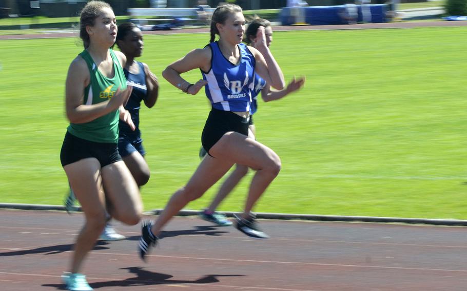 High school sprinters look to finish first in the 100-meter dash during a track meet at RAF Lakenheath, England, Saturday, May 19, 2018. SHAPE runner Alexia Tarvis earned first place with a 13.21 second finish.
