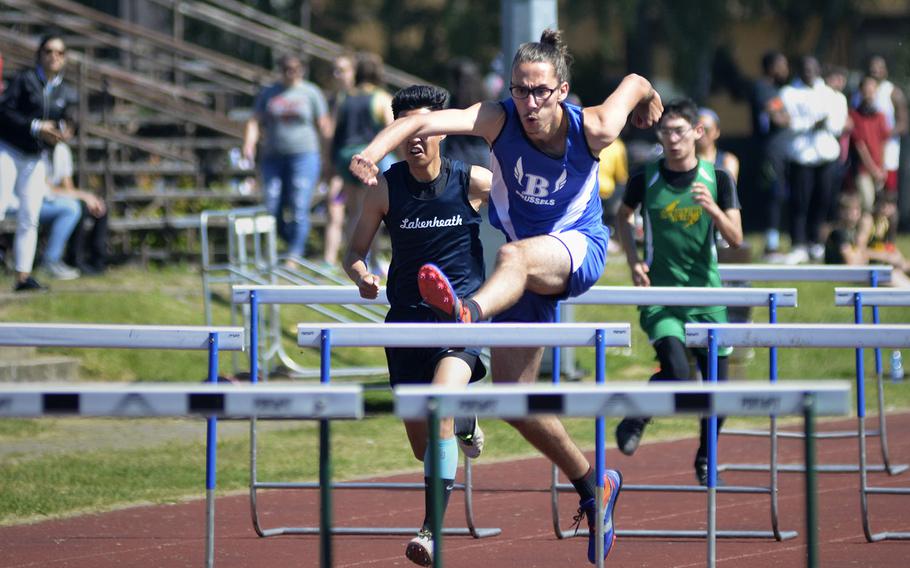 Brussels athlete Alparslan Sundseth pulls ahead in the 110-meter high hurdles during a high school track meet at RAF Lakenheath, England, Saturday, May 19, 2018. Sundseth clocked in at 16.44 seconds for first place.
