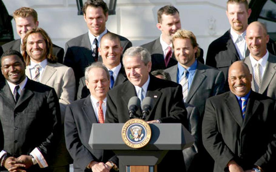 Red Sox players, coaches and officials laugh as President Bush makes a joke during Wednesday&#39;s ceremony.