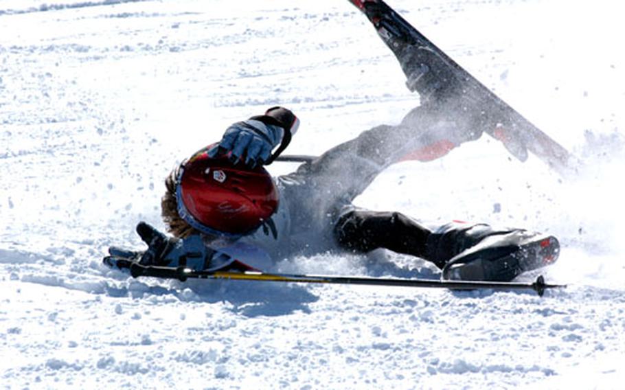 10-year-old Chelsea Smithback falls on the slalom course. Smithback, who had been in contention in the youth girls division before the spill, earned a bronze medal in Saturday&#39;s giant slalom championship.