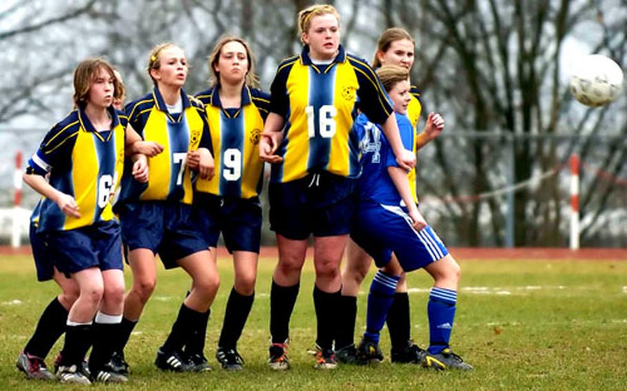 Wiesbaden defenders form a wall against a free kick during their 1-0 loss to the Ramstein girls on Saturday in Wiesbaden, Germany.