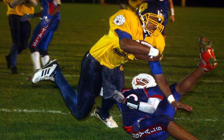 Ramstein&#39;s Ste&#39;phan James drags down Heidelberg&#39;s Chris Jones, but not before Jones crosses the goal line for the Lions&#39; first touchdown.