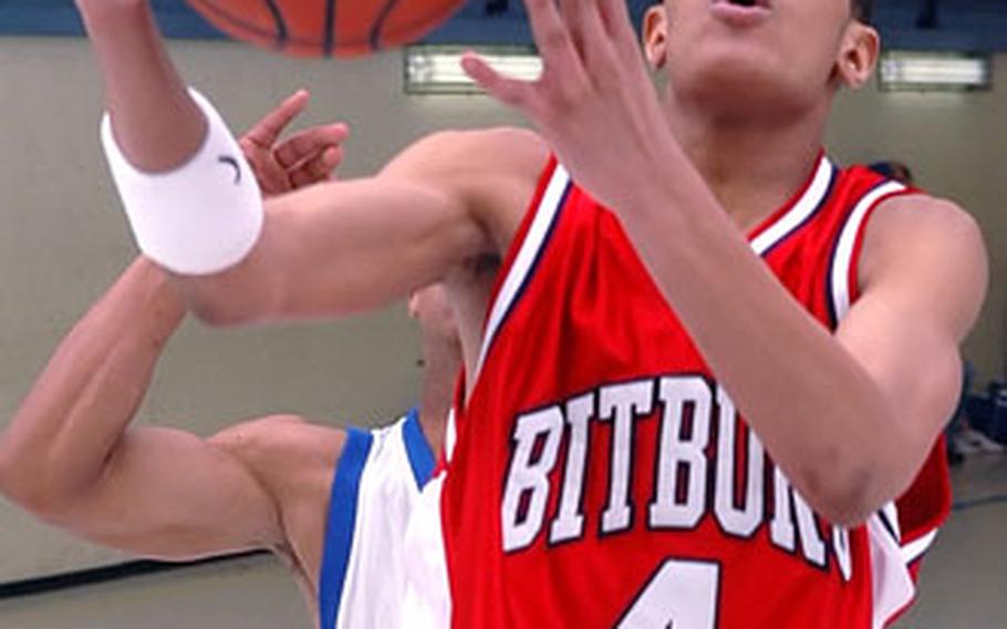 Bitburg’s Charles Whatley scores the winning basket in a 56-53 victory over Wiesbaden.