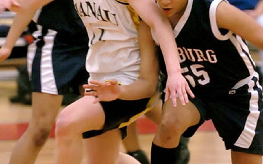 Bitburg’s Melissa James, right, strips the ball from Hanau’s Kyri Bye-Nagel during the DODDS-Europe Division II girls championship game in Mannheim, Germany, on Feb. 25. Both players were named to the 2006 All-Europe basketball team.