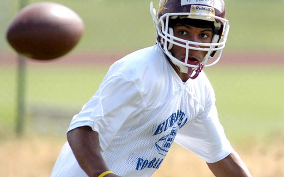 Baumholder&#39;s Rashad Taylor keeps his eyes on the ball during a practice drill for running backs.