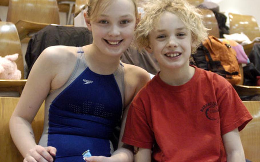 Alaina Scifo, left, and her brother, Dominic Scifo, of the Lakenheath Barracudas relax after hauling in five first places between them on Saturday at the European Forces Swim League Championships in Berlin. Dominic set a league record in the 200-meter freestyle for boys ages 8 and under with a time of 3 minutes, 10.56 seconds.