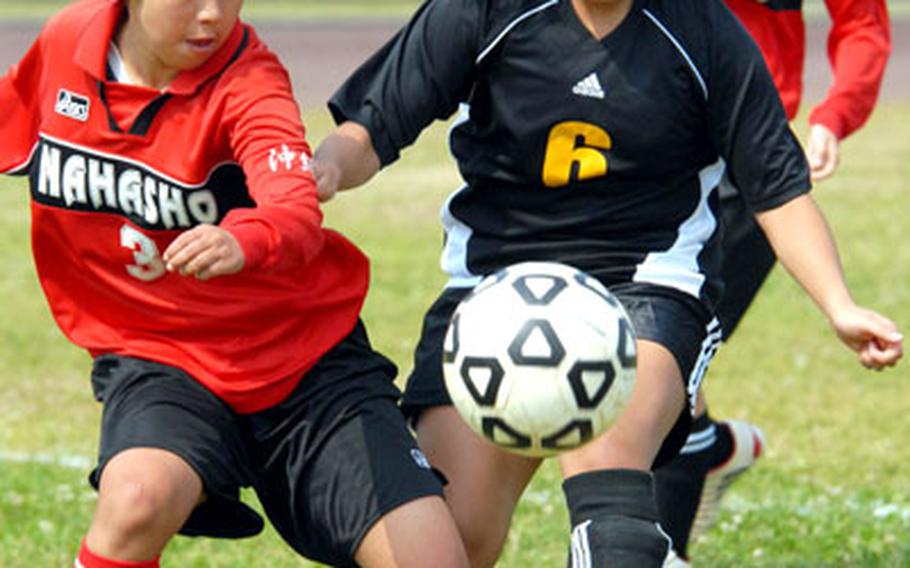 Destinee Ancog (6) prepares to fire a shot at the goal between Naha Commerical High School defenders during Saturday&#39;s game. Ancog scored on the play and the Panthers began their first season since 2002 without a player named Abel in the lineup by blanking Naha Shogyo 2-0.