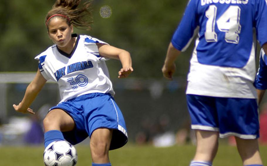 Rota sophomore Ashley Stedge drives the ball past Cali Steffenhagen of Brussels during their DODDS-Europe Division IV girls soccer championship game Friday at Ramstein High School. Stedge scored one goal in the 2-0 victory.