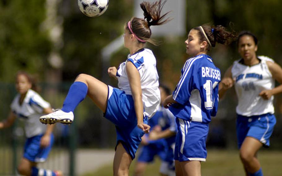 Rota&#39;s Bryanna Hudson moves the ball over Alexandra McVicker of Brussels.