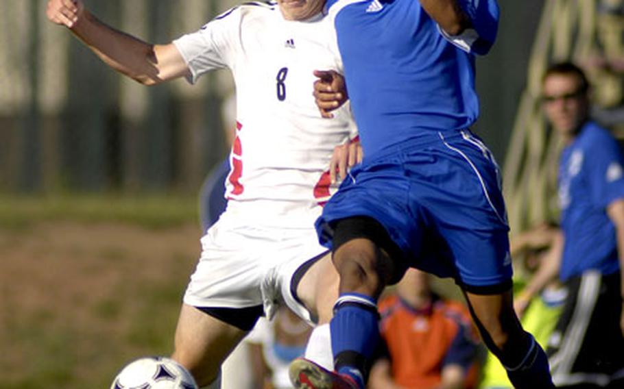 Kevin Beerman, left, of Heidelberg and Glenn Verley of Ramstein battle for possession.