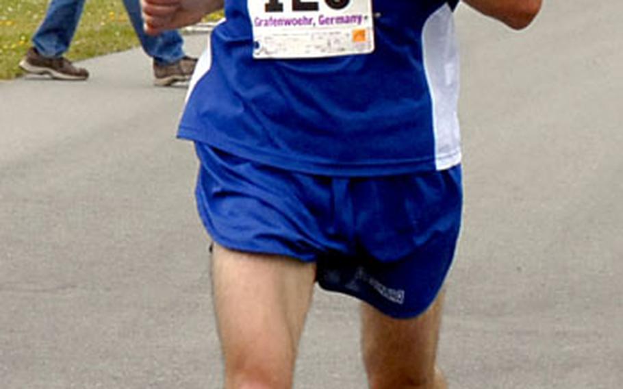 Army Staff Sgt. Kirk Madgic of Vicenza, Italy, nears the finish line. Madgic was the first active-duty Army man to cross the line, with a time of 58 minutes 46 seconds.