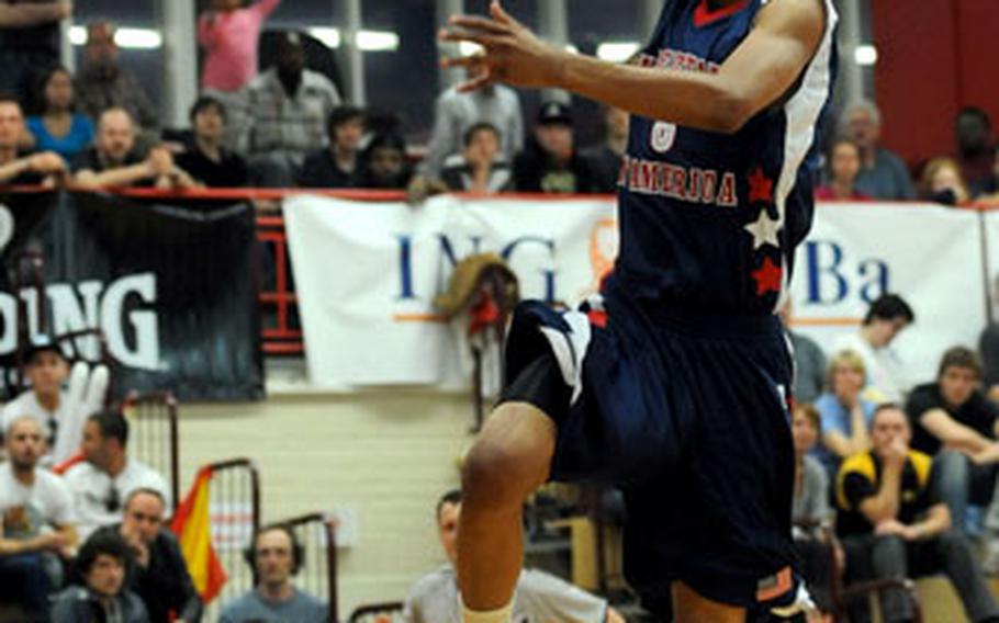 Damian Leonard of the United States sails to the basket on a fast break. Leonard scored 19 points in the game.