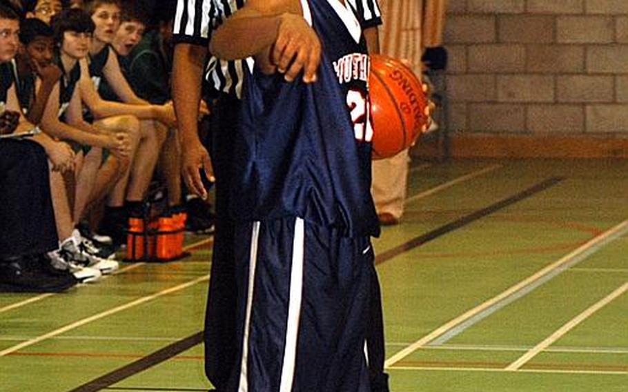 Chris Jackson calls out an offensive play from his point guard position during a game against Rota last Friday. Jackson took on the roles of point guard and team leader after an early-season injury to the Mustangs' captain.