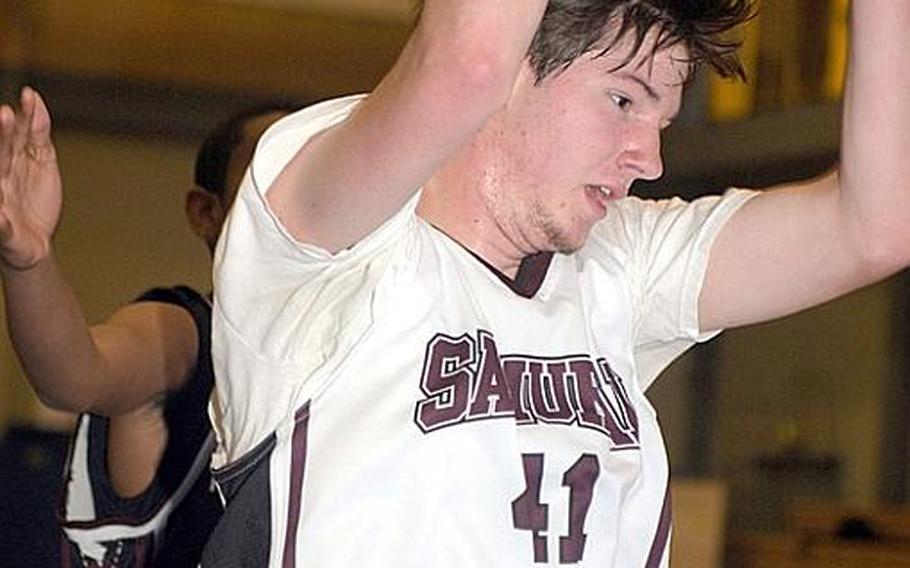 Matthew C. Perry's Hayden Miller snags a rebound against Zama American during Thursday's first-round game in the 5th DODDS-Japan Basketball Tournament at Yokota High School, Japan. Zama beat Perry, 61-52.