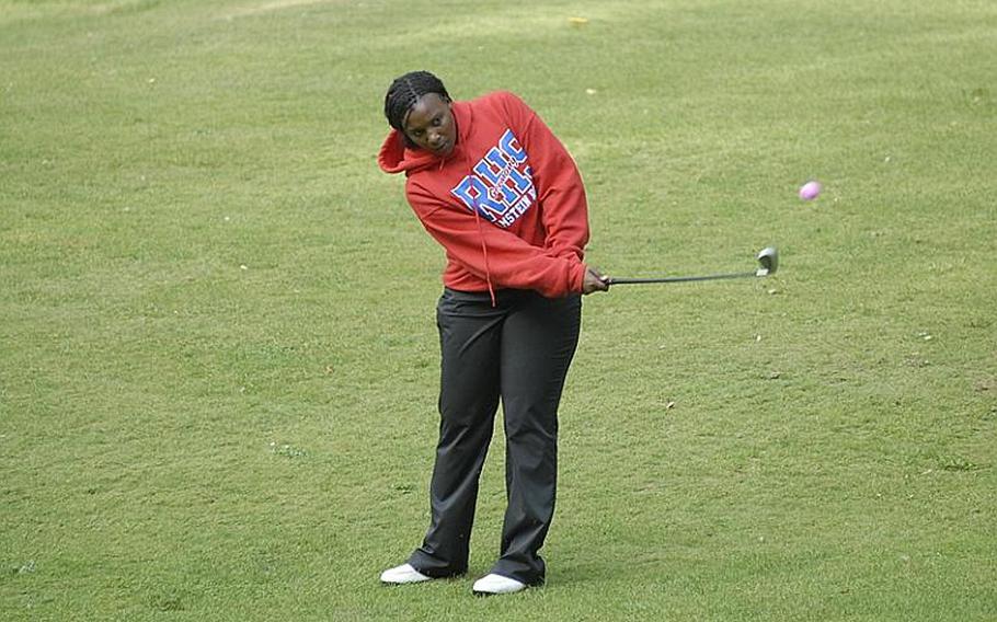 Ramstein sophomore Diana Green, top girls scorer on Thursday, chips the ball to the green at Rheinblick Golf Course in Wiesbaden, Germany.