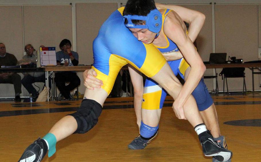 Yokota 101-pounder Shintaro Clanton grapples for the advantage with St. Mary's Ray Okuno during Saturday's Kanto Plain Association of Secondary Schools wrestling finals at St. Mary's International School, Tokyo. Clanton pinned Okuno in 3 minutes, 54 seconds.