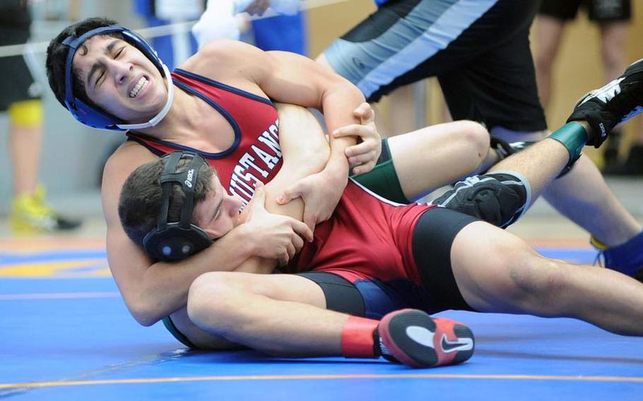 Menwith Hill's Alex Abing presses Tyler Williams of Naples to the mat in their 145-pound match in opening day action at the DODDS-Europe wrestling finals in Wiesbaden, Friday. Abing won with a fall at 3:39.