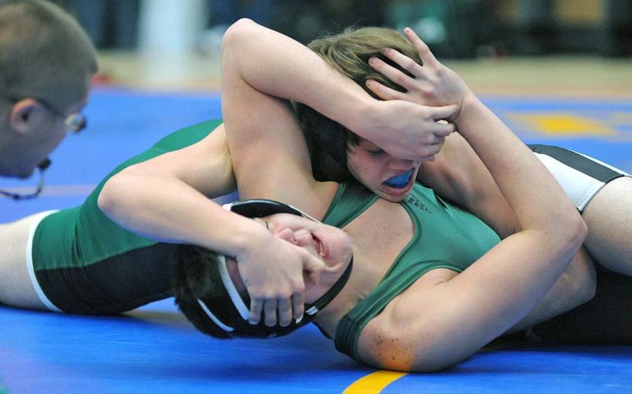 Josh Hensy of Naples, top and Ankara's Joseph Anastasia battle in a 182-pound match on opening day of the DODDS-Europe wrestling finals in Wiesbaden, Friday. Hensy won a 9-4 decision.