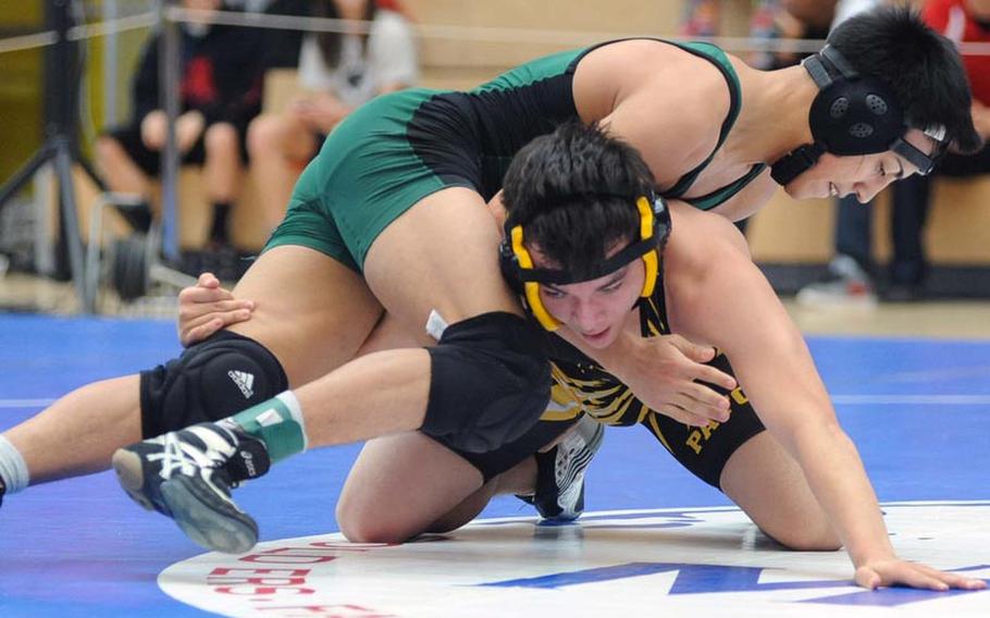 In a 126-pound match at the DODDS-Europe wrestling championships Patricio Hernandez of Naples, top, defeated Patch's Chris Carlisle with a 13-0 major decision.