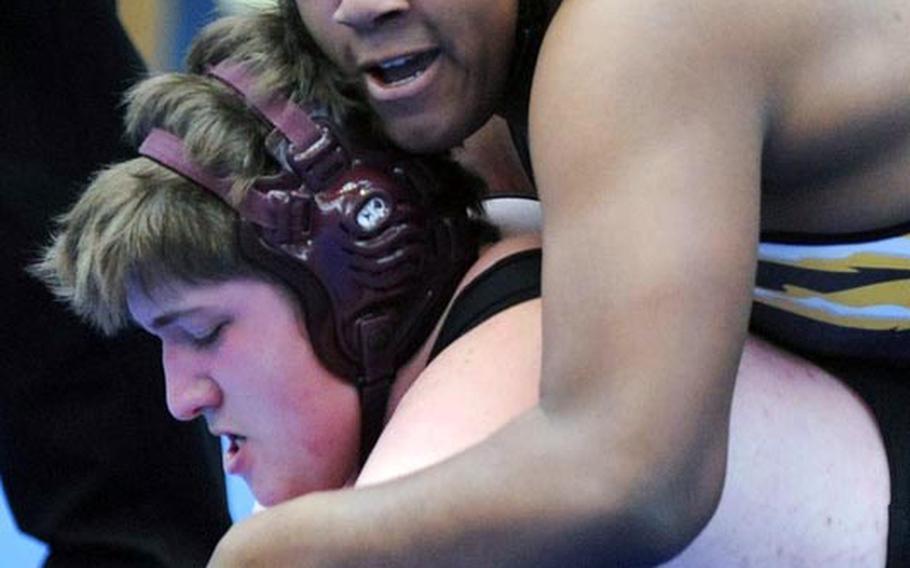 Patch's Trever Mickles, right, has the grip on Nikolas Scheffler of Baumholder in their 285-pound match. Mickles won the opening round match at the DODDS-Europe wrestling finals with a fall at 1:46.