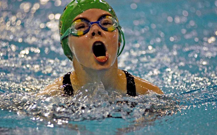 Mackenzie Burgoyne, 8, with the SHAPE Seals comes up for air during her first place performance in the girls 8-and-under 100-meter Individual Medley Saturday at Eindhoven, Netherlands.