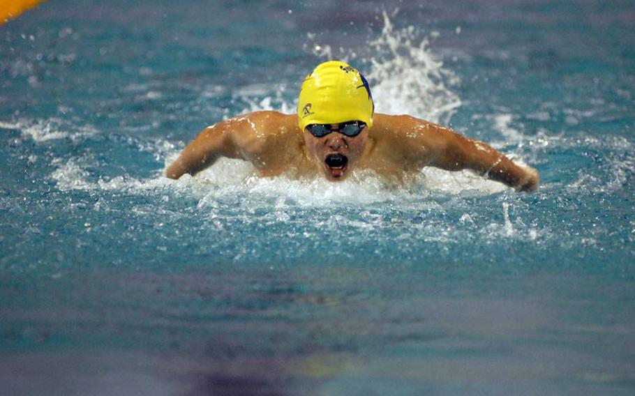 Brian Burke, 14, with the Sigonella Swordfish, competes in the 100-meter butterfly during Saturday's opening day action of the 2012 European Forces Swim League championships at Eindhoven, Netherlands.  Burke finished third in the event, behind Marcello Rossi, 13, from Brussels and James Jones, 14, from Vicenza.