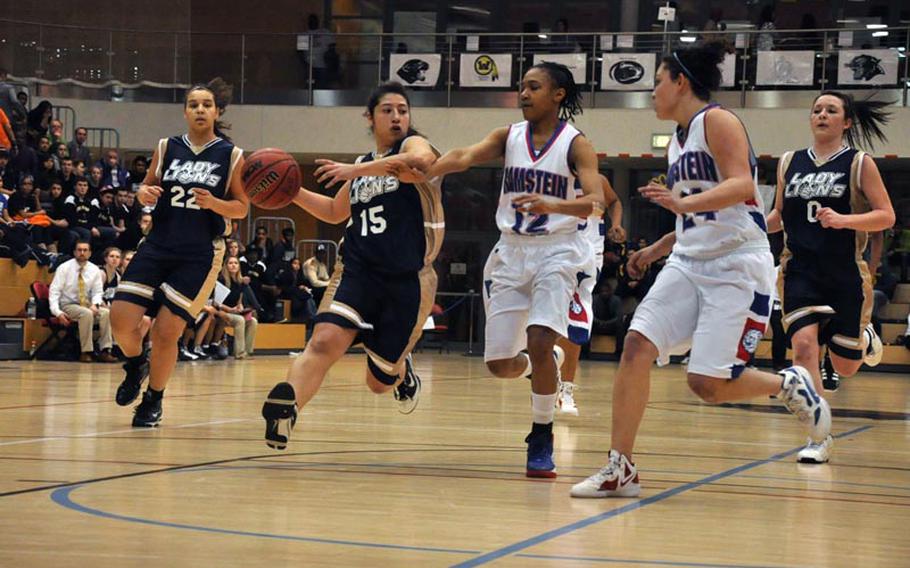 Heidelberg's Rebecca Luna moves the ball down court against the Ramstein Lady Royals defense Saturday in the Division I championship game in Wiesbaden, Germany. Heidelberg captured the title with a 32-31 win.